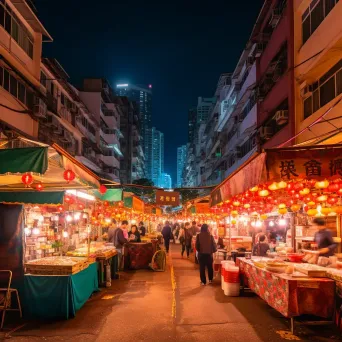 Bustling night market with colorful food stalls and lanterns under city lights - Image 2