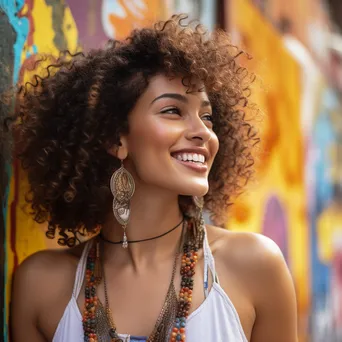 Close-up of a smiling young woman from a multicultural background in front of a colorful mural - Image 3