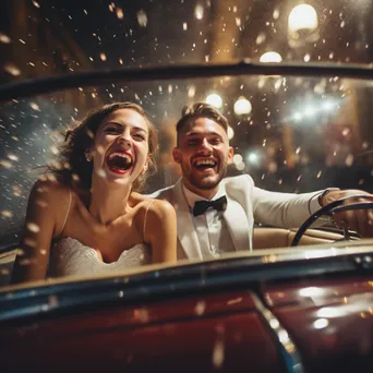 Newlyweds waving goodbye while driving away in vintage car. - Image 1