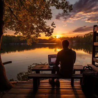 Digital nomad working on a laptop by the lake - Image 4