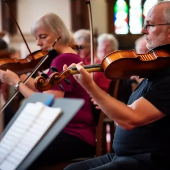 Local community orchestra performance with musicians playing classical music and conductor leading - Image 4