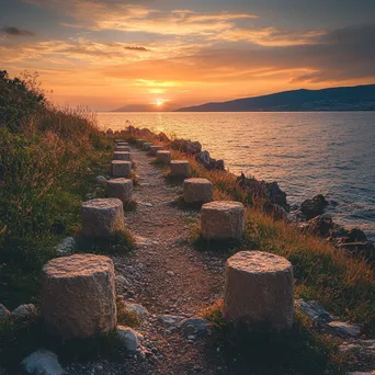 Ancient stone-marked pathway by the sea at golden hour - Image 3