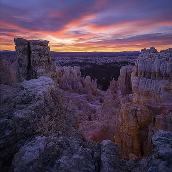 Serene landscape of rock formations framed by sunset - Image 3