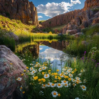 Desert oasis with wildflowers and pond framed by cliffs - Image 4