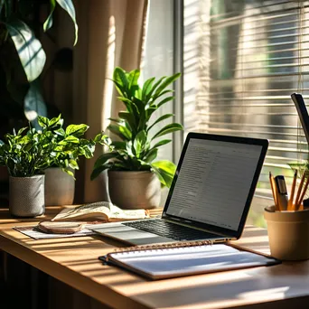 Modern Workspace with Laptop and Notebook