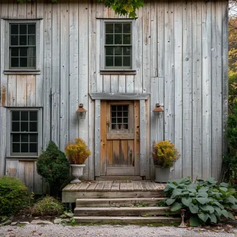 Rustic farmhouse exterior with off-center door on Leica Q2 - Image 1