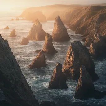 Coastal sea stacks illuminated by sunrise - Image 1