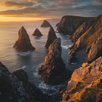 Coastal sea stacks illuminated by sunrise - Image 3