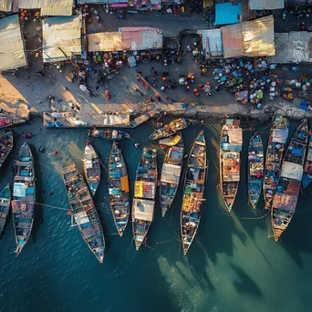 Aerial shot of a busy fishing port with colorful boats and market activity. - Image 3