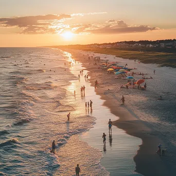 Families enjoying a vibrant sunset beach scene with colorful beach umbrellas and gentle waves. - Image 2