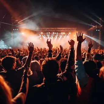 Full band performing at an outdoor festival with engaged audience. - Image 2