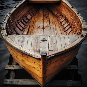 High-angle shot of a wooden boat resting on supports in natural light - Image 3