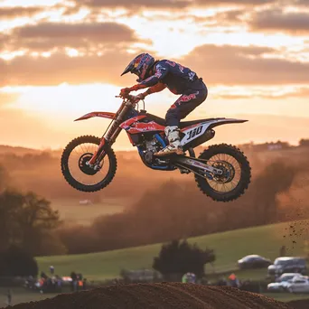 Motocross rider performing trick in mid-air - Image 2