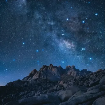 Gemini constellation over mountain range at night - Image 3