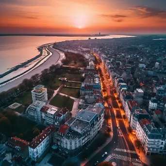 Aerial view of a coastal city at sunset with vibrant architecture - Image 3