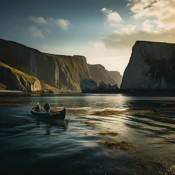 Fisherman casting a net from a small boat with cliffs in the background. - Image 1