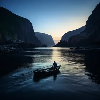 Fisherman casting a net from a small boat with cliffs in the background. - Image 3