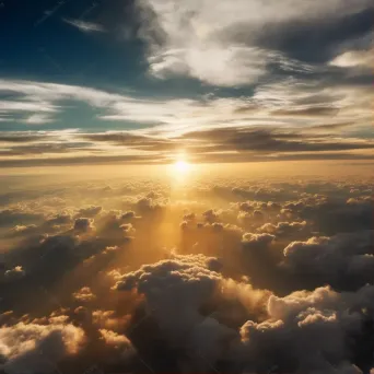 Golden sun setting over dramatic clouds seen from airplane window - Image 1