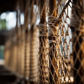 Close-up of traditional rope bridge weaving - Image 1