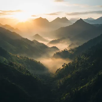 Misty mountains with valleys in fog during sunrise - Image 3