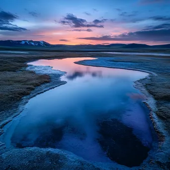 Deserted geothermal spring at twilight with colorful reflections. - Image 1