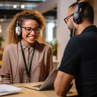 Friendly customer service representative assisting a client on a call - Image 1