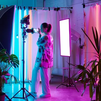 Fashion influencer taking photos behind the scenes in a studio - Image 4