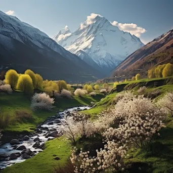 Mountain valley in early spring with snow-capped peaks and greenery - Image 2