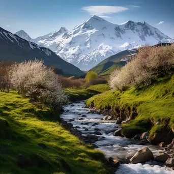 Mountain valley in early spring with snow-capped peaks and greenery - Image 4