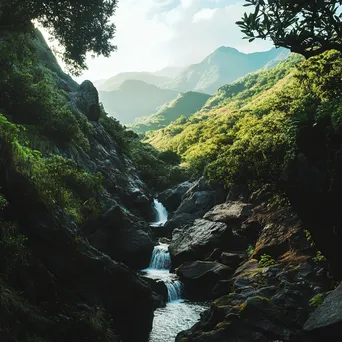 Hidden waterfall in mountain valley surrounded by lush greenery - Image 1