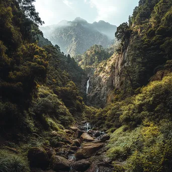 Hidden waterfall in mountain valley surrounded by lush greenery - Image 4