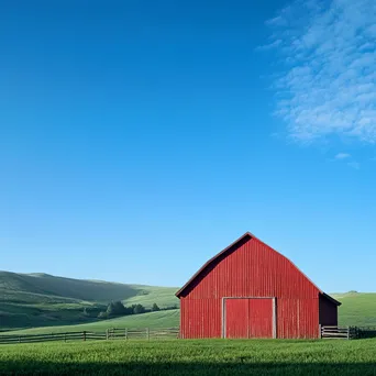 Tall red barn against rolling green hills - Image 3