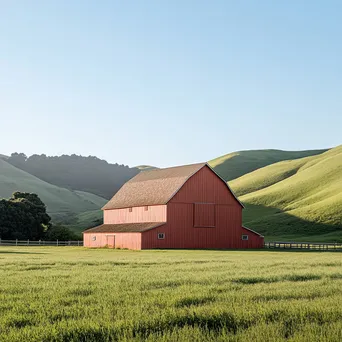 Tall red barn against rolling green hills - Image 4