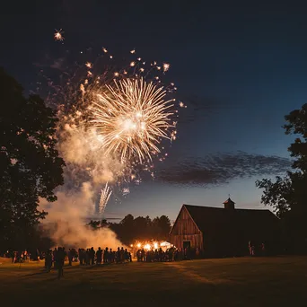 Fireworks exploding in the countryside with a barn and families celebrating New Year