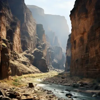 Aerial view of a spectacular canyon with a narrow river and cliffs - Image 1