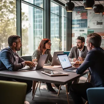 Group of professionals discussing strategies in a modern office - Image 4