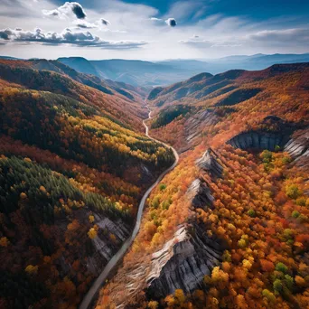 Aerial view of a mountain ridge surrounded by autumn foliage - Image 4