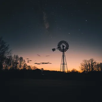 Silhouette of American windmill under a starry sky - Image 2