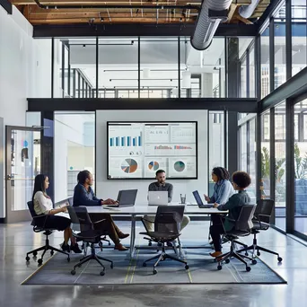 Diverse team around a conference table in an office - Image 4