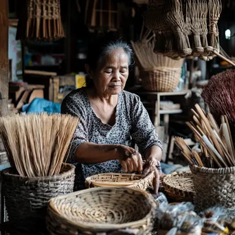 Artisans practicing basket weaving in a light-filled workshop - Image 4