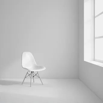 Minimalist white room with a single chair - Image 2