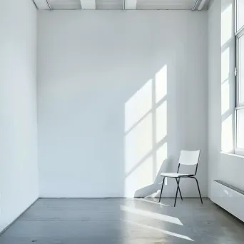 Minimalist white room with a single chair - Image 4