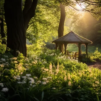 Woodland clearing with a gazebo surrounded by blooming flowers. - Image 1