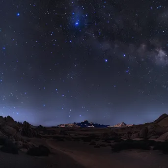 Starry sky over glowing desert sand dunes at night - Image 4