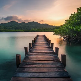 Wooden pier extending into lagoon on tropical island - Image 2