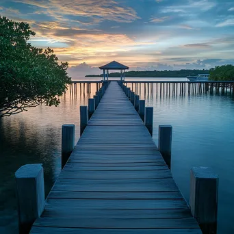 Wooden pier extending into lagoon on tropical island - Image 3