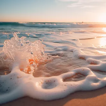 Blurred beach scene with gentle waves and sandy shore - Image 1