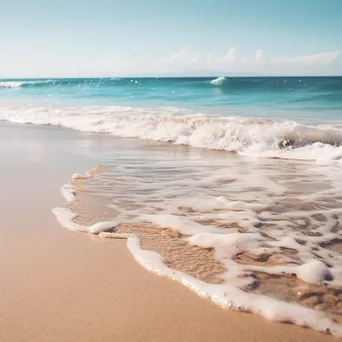 Blurred beach scene with gentle waves and sandy shore - Image 3