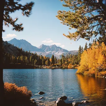 Enchanting alpine lake surrounded by colorful autumn trees - Image 3