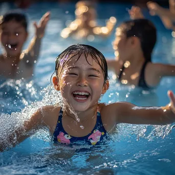 Kids enjoying water aerobics in a shallow pool - Image 1